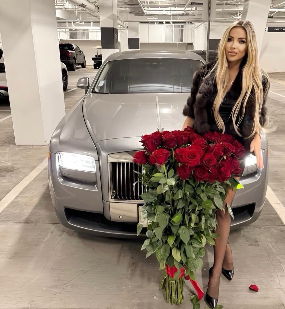 Creator with a bouquet of red roses